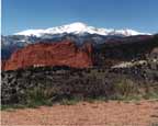 Colorado pictures / Colorado Springs Photography: ”Red, White, and Blue”.   This Grabo' photograph is a buffet of colors - take your pick!  Image of Pike's Peak and the Garden of the Gods in Colorado Springs.  Click here a better view.