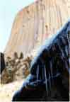 Wyoming Photography by Steve Grabowski / Wyoming pictures:  "The Devil's Toothpicks."  Not your average photograph of Devil's Tower, Wyoming.  The focus is on the icicles in the foreground.   This one will cool you off in the dog days of summer.  It calls out, "Hang me on your wall - please?