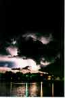 Ligntning photography / Laramie, Wyoming pictures: "Lightning, LaBonte Lake."   Magnificent lightning photograph reflected in water.  Stars, thunderhead, city lights.  This one gets more rave reviews than any other image I have ever taken.  Click here to get the "big picture!"